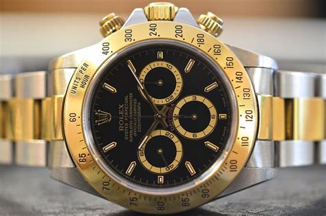 rolex daytona acciaio oro quadrante nero prezzo